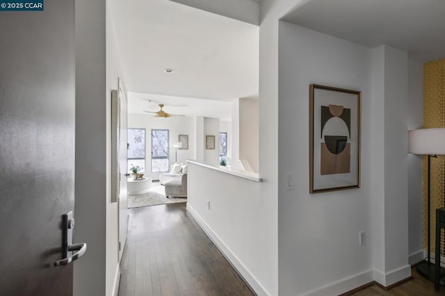 corridor featuring dark hardwood / wood-style flooring