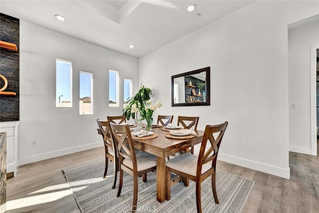 dining space with light hardwood / wood-style floors