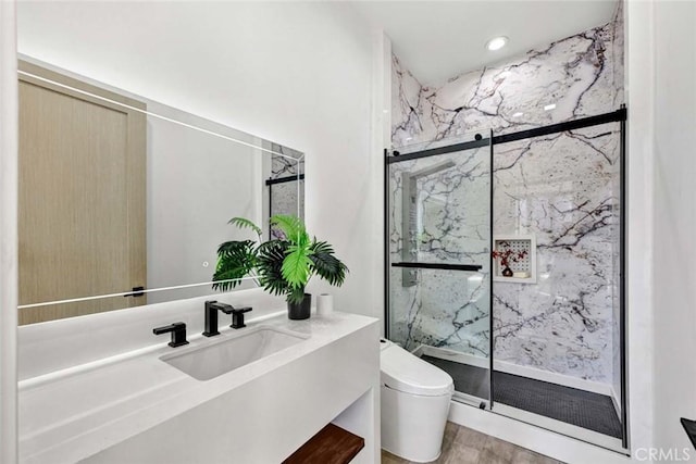 bathroom with walk in shower, vanity, toilet, and hardwood / wood-style floors