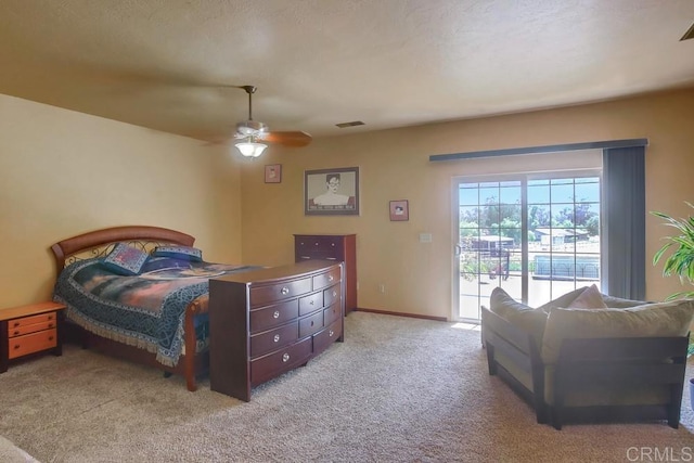 carpeted bedroom featuring access to exterior and ceiling fan