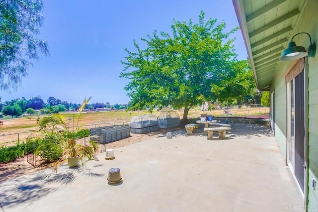 view of patio / terrace with a rural view