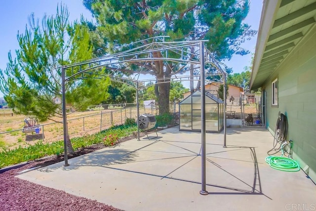 view of patio featuring an outbuilding