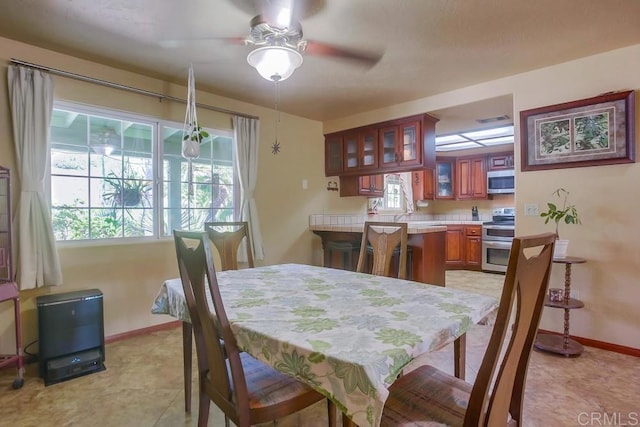 dining area featuring a wealth of natural light and ceiling fan