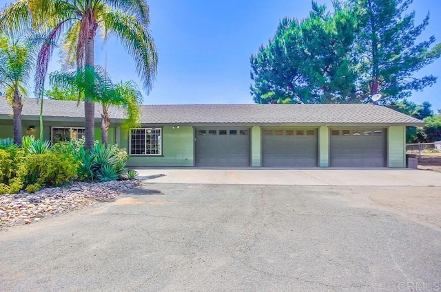 ranch-style home with a garage