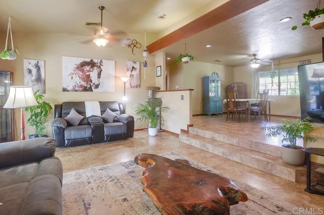 living room with ceiling fan and tile patterned flooring