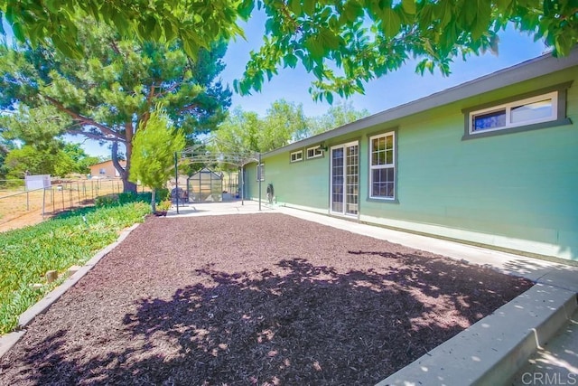 rear view of property featuring a patio