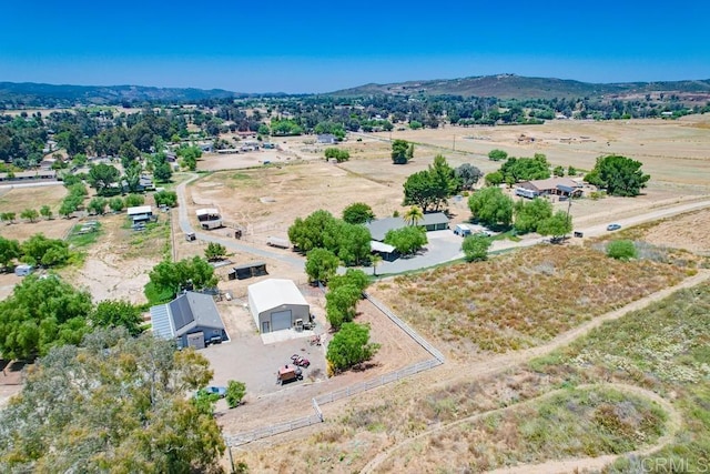 bird's eye view featuring a rural view and a mountain view