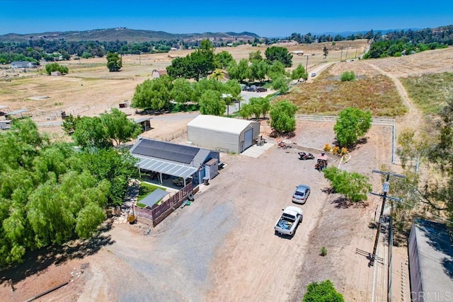 birds eye view of property featuring a rural view and a mountain view