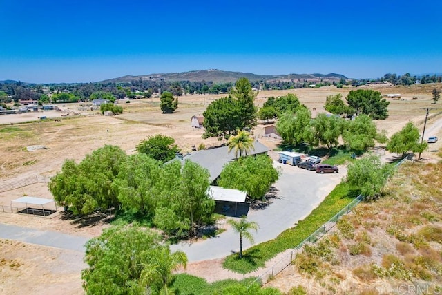 drone / aerial view featuring a rural view and a mountain view