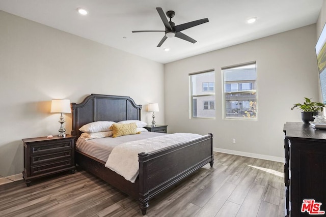 bedroom with dark wood-type flooring and ceiling fan