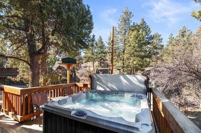 wooden terrace with a hot tub