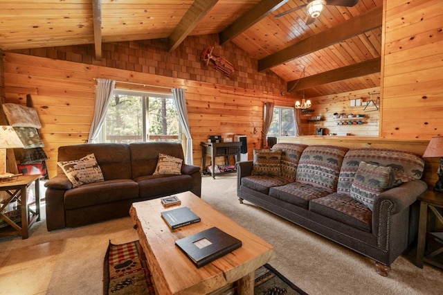 carpeted living room with vaulted ceiling with beams, plenty of natural light, and wood walls