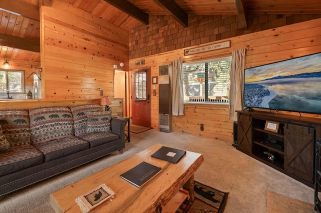 living room featuring vaulted ceiling with beams, wooden ceiling, wood walls, and carpet