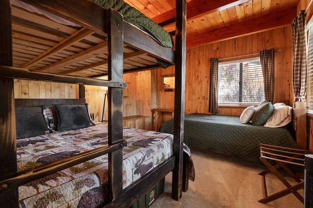 bedroom with carpet flooring and wood walls