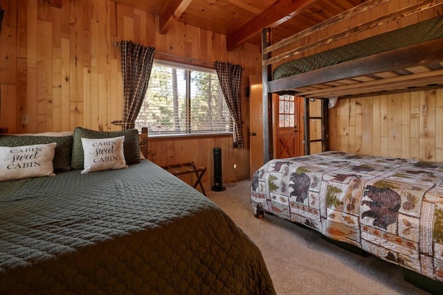 bedroom with carpet, wooden ceiling, beam ceiling, and wood walls