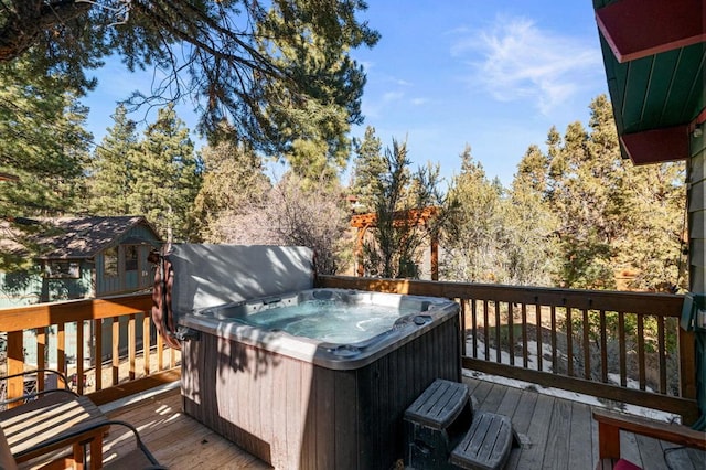 wooden terrace with a hot tub