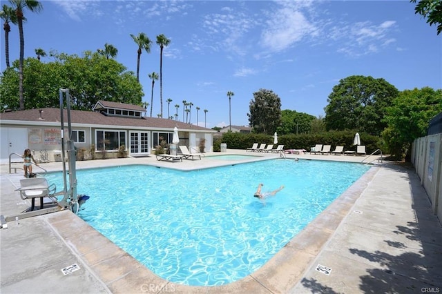 view of swimming pool with a patio area