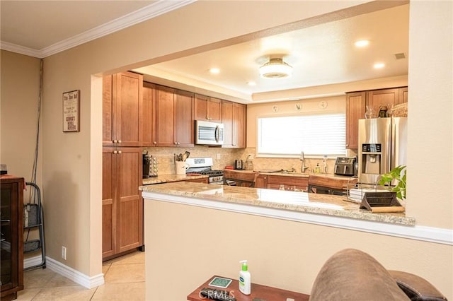 kitchen with light tile patterned floors, ornamental molding, kitchen peninsula, stainless steel appliances, and backsplash