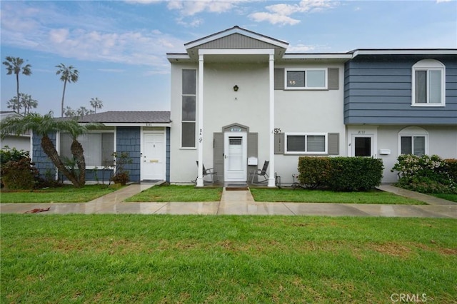 view of property featuring a front yard