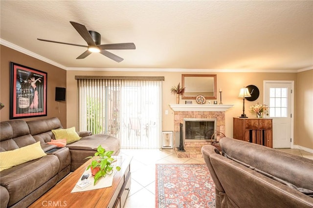 tiled living room featuring a tile fireplace, ornamental molding, a textured ceiling, and ceiling fan