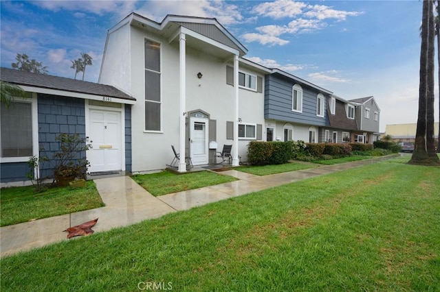 view of property featuring a front yard