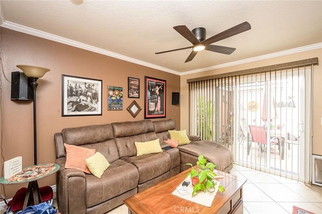 living room with crown molding, ceiling fan, a textured ceiling, and light tile patterned floors