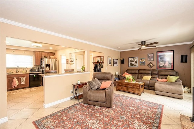 living room featuring light tile patterned floors, crown molding, sink, and ceiling fan