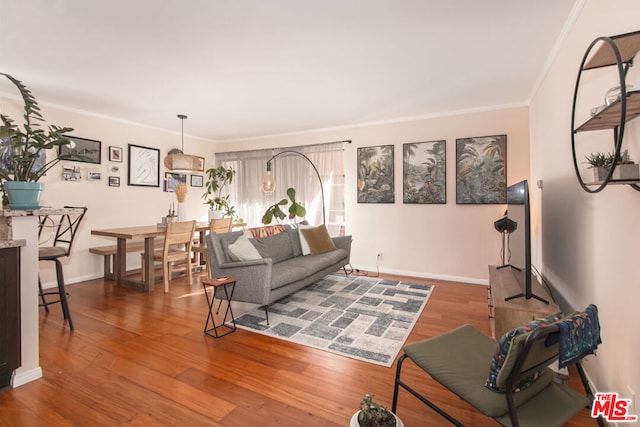 living room featuring crown molding and hardwood / wood-style floors