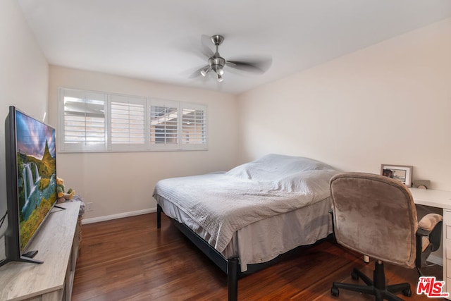 bedroom featuring dark hardwood / wood-style flooring and ceiling fan