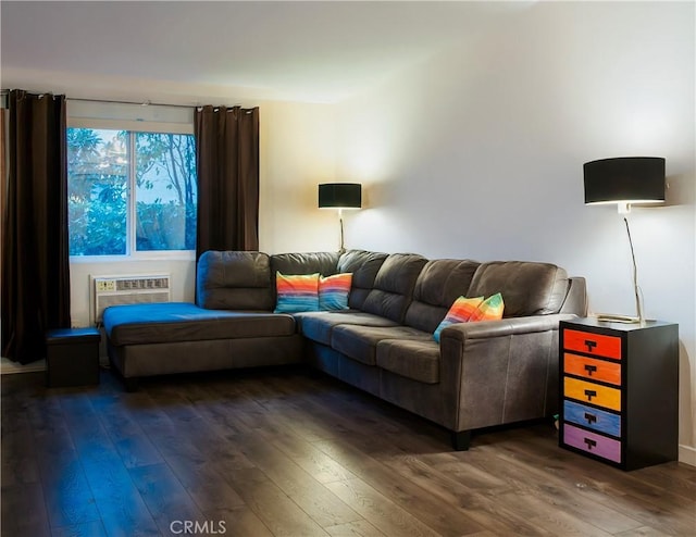 living room with dark hardwood / wood-style floors and a wall mounted AC