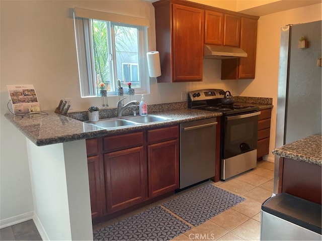 kitchen featuring sink, light tile patterned floors, and appliances with stainless steel finishes