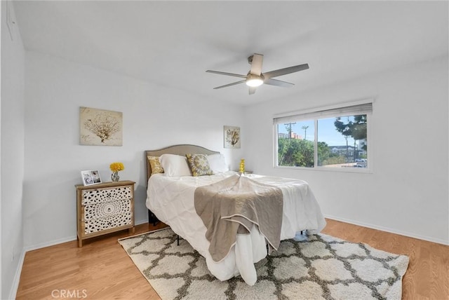 bedroom featuring hardwood / wood-style floors and ceiling fan