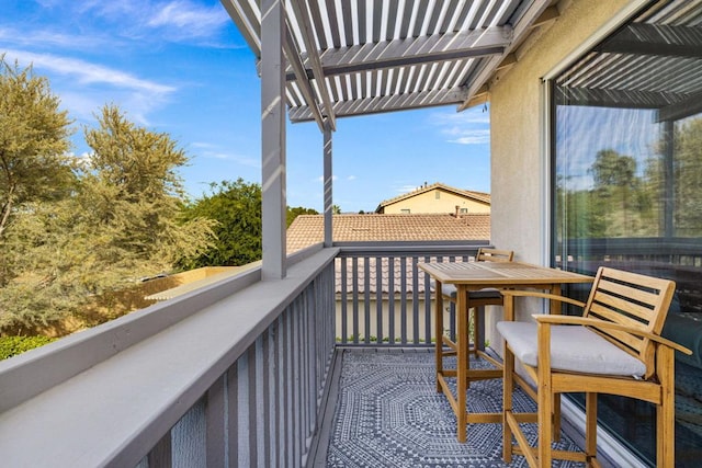 balcony featuring a pergola