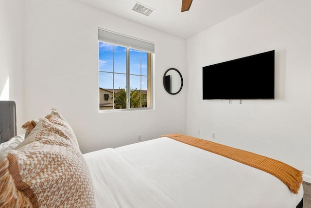 bedroom featuring hardwood / wood-style floors and ceiling fan