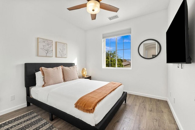 bedroom featuring wood-type flooring and ceiling fan