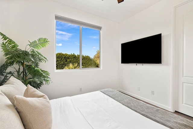 bedroom featuring ceiling fan and wood-type flooring