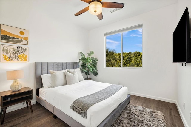 bedroom featuring ceiling fan and dark hardwood / wood-style flooring