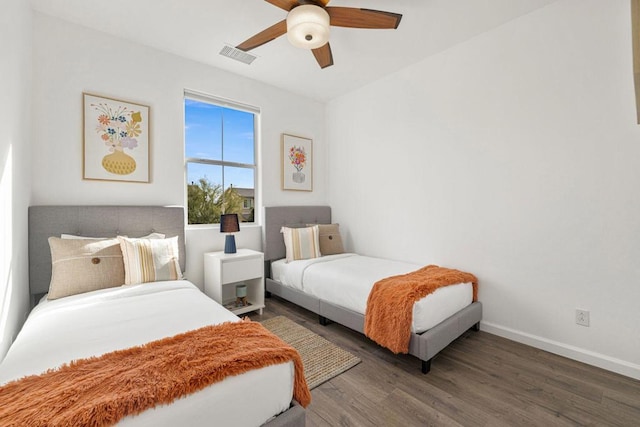 bedroom featuring dark wood-type flooring and ceiling fan