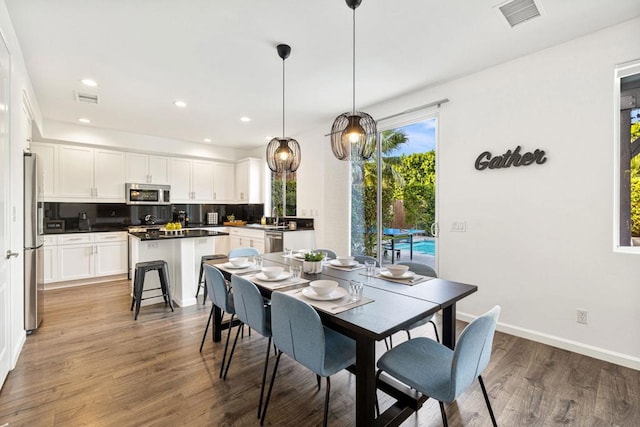 dining room featuring dark hardwood / wood-style floors and sink