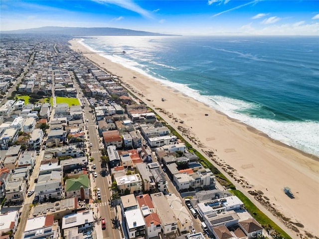 aerial view featuring a view of the beach and a water view