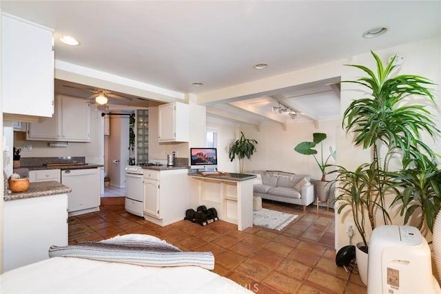 kitchen featuring beamed ceiling, ceiling fan, white cabinets, and white appliances