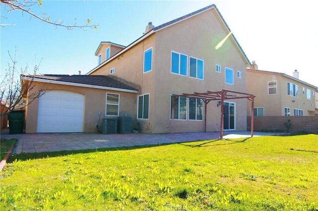 rear view of property with cooling unit, a garage, a yard, and a pergola