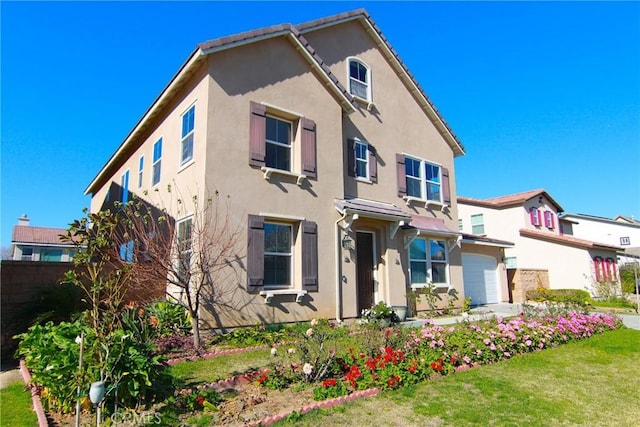 view of front facade with a garage and a front yard