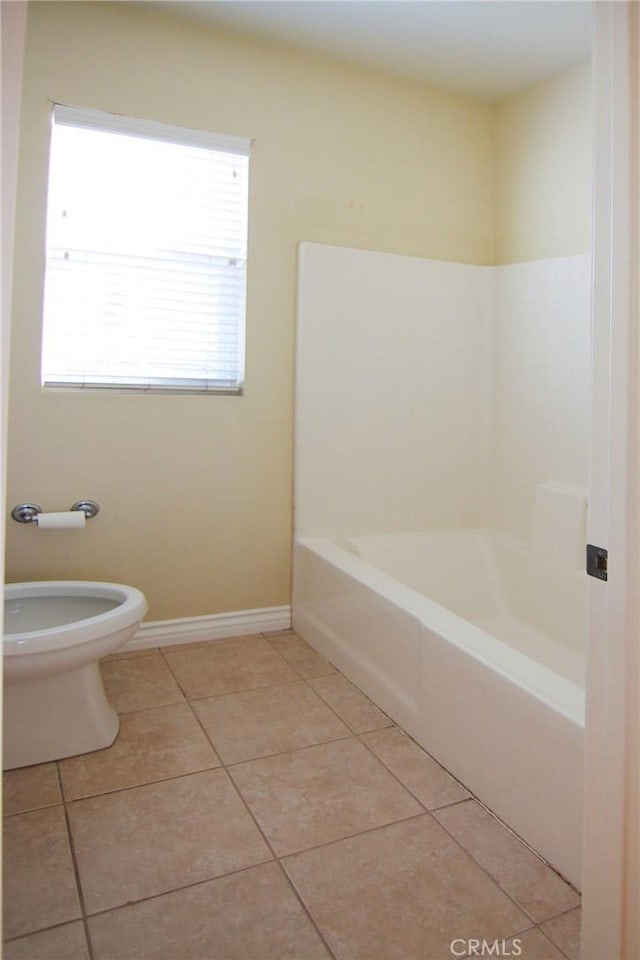 bathroom with tile patterned floors and toilet