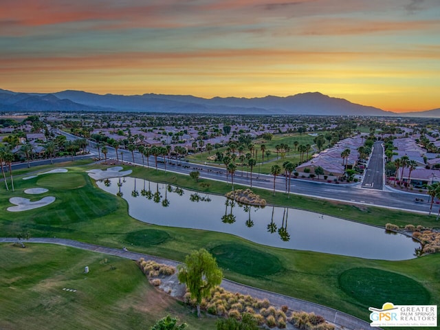 aerial view at dusk with a water and mountain view