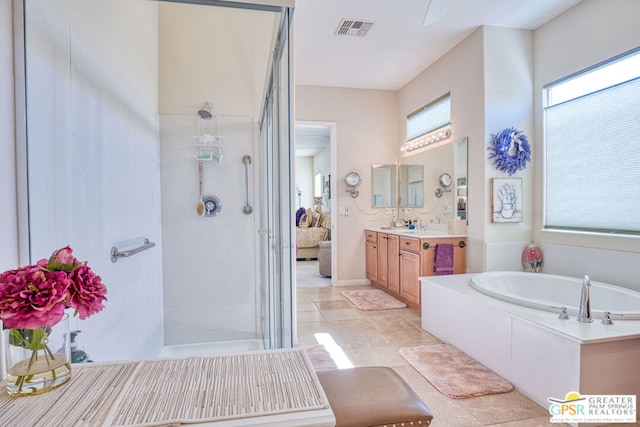 bathroom featuring plus walk in shower and vanity