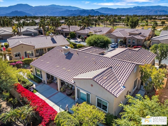 birds eye view of property with a mountain view