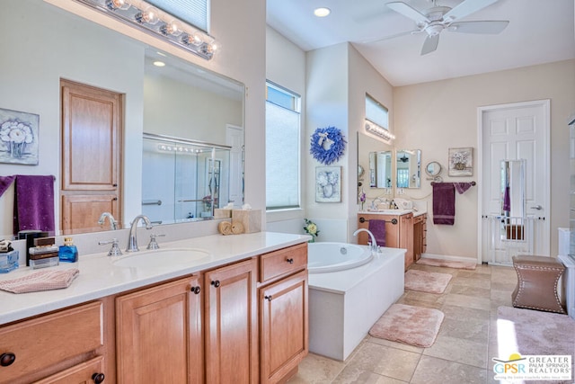 bathroom featuring vanity, ceiling fan, and plus walk in shower