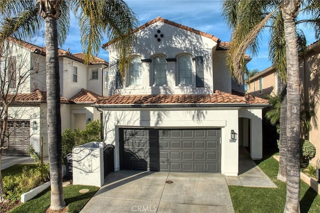 mediterranean / spanish-style home with a garage