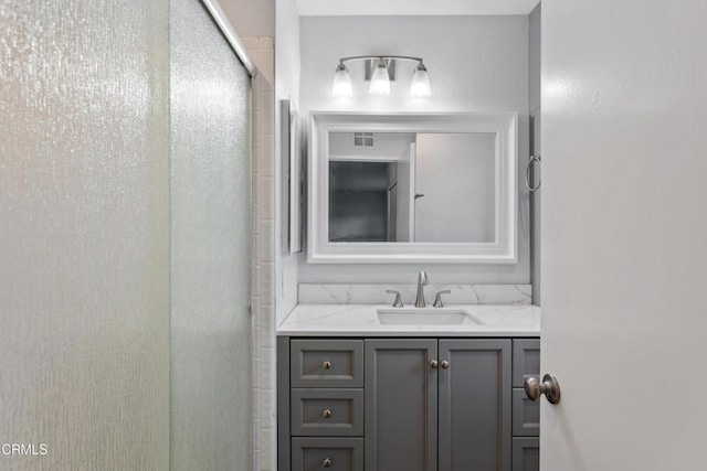 bathroom with vanity and an enclosed shower